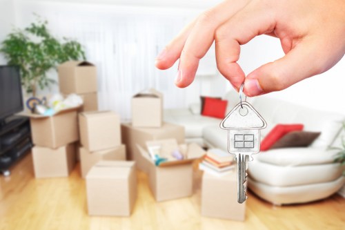 Removal professionals carefully loading household items for a move in Kennington