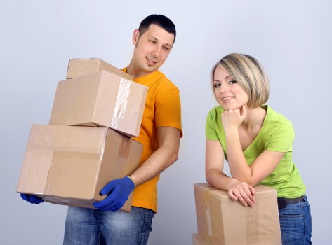 Packed office boxes and furniture ready for transport
