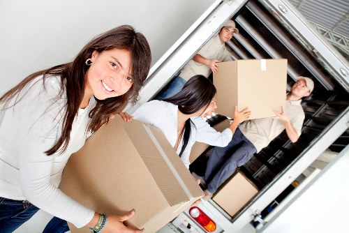 Local movers handling furniture and boxes near Kennington homes